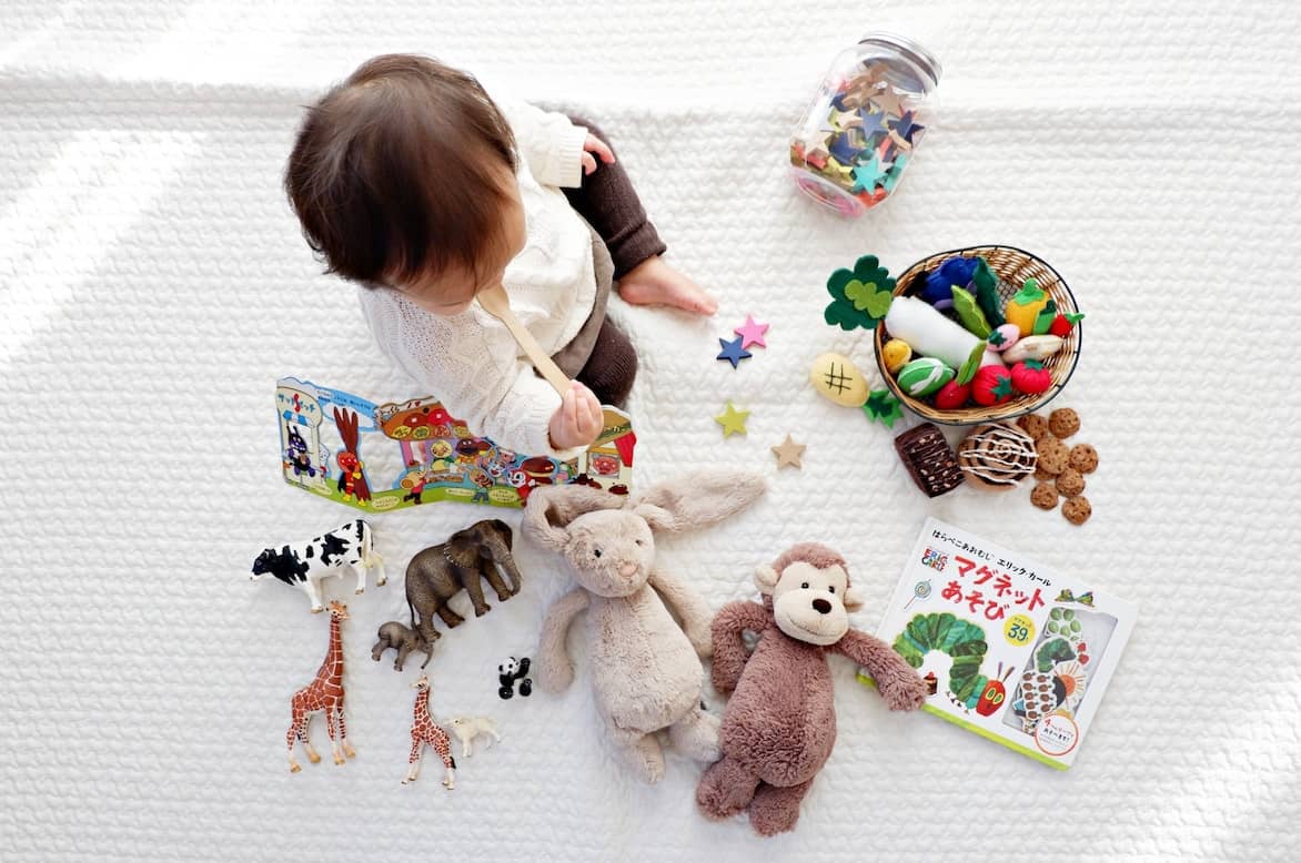 Toddler playing with toys